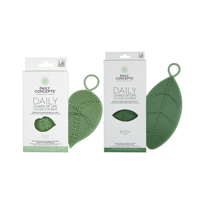 Two green leaf-shaped silicone scrubbers—the Leaves of Life Facial Silicone Scrubber + free gift—are shown beside their Grove Collaborative packaging.
