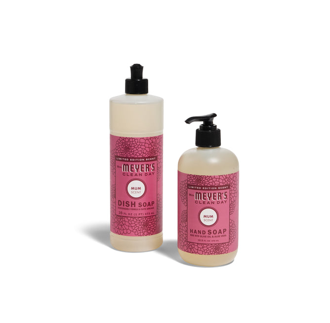 The Mrs. Meyers Crisp & Clean Sinkside Set - Mum features a tall dish soap with a flip cap and a shorter hand soap with a pump, both displayed on a white background with pink Mum-scented labels.