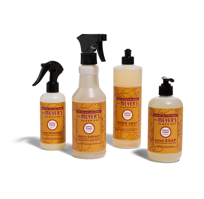 The Mrs. Meyers Autumn Breeze Cleaning Set in Apple Cider, featuring room freshener, multi-surface cleaner, dish soap, and hand soap, is grouped together on a white background.