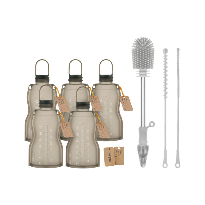 Six gray Haakaa reusable milk storage packs with black caps and brown tags are shown next to a free silicone bottle brush kit, which includes a large brush and two thin straw cleaners. Offer: Buy Reusable Milk Storage Pack, get Bottle Brush Kit free.
