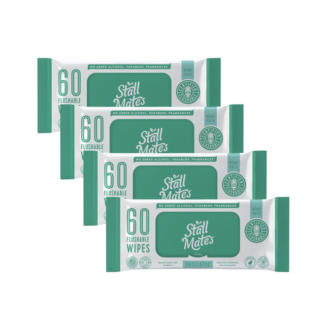 Four packs of Stall Mates Flushable Wipes Set, each with 60 hypoallergenic, unscented wipes, are arranged in a row. The green and white packaging notes theyre septic-safe and free from alcohol, parabens, and fragrances.