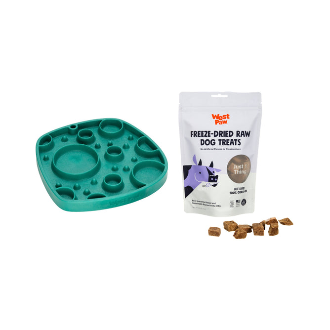 A green All-in-One Feeder & Lick Mat from West Paw, with free beef liver dog treats, plus several cube-shaped treats scattered nearby—all set against a white background.