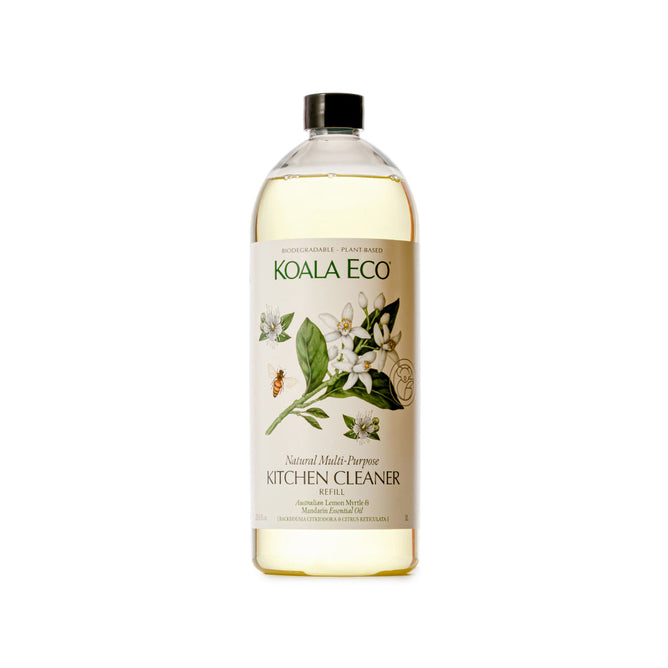 Koala Ecos Multi-Purpose Kitchen Cleaner Refill comes in a clear bottle with a black cap, featuring a label adorned with flowers and a bee. Infused with Lemon Myrtle and Australian Essential Oils, its biodegradable, plant-based, and eco-friendly.