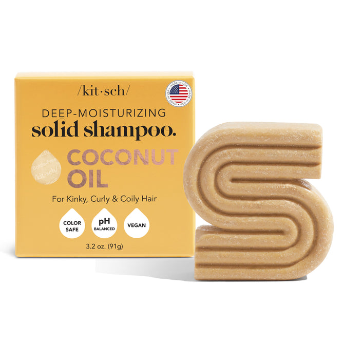 The Kitsch Coconut Oil Deep Moisturizing Shampoo Bar, styled as a large letter S in a yellow box, is perfect for kinky, coily hair. Its enriched with coconut oil, color-safe, pH balanced, and vegan-friendly.