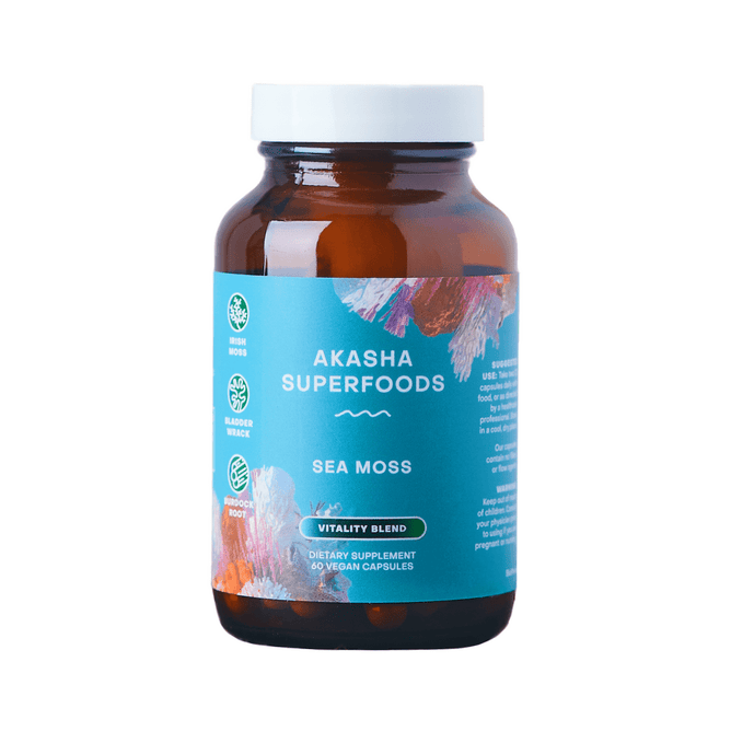 A brown bottle of Akasha Superfoods Sea Moss Vitality Blend Capsules features a turquoise label, white lid, and colorful designs. It contains 60 vegan capsules with Organic Irish Moss and Organic Bladderwrack for dietary vitality support.