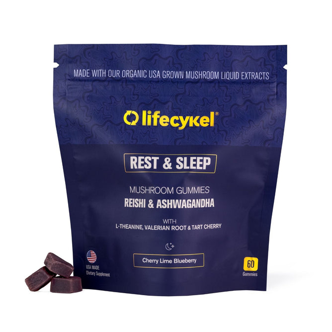 A blue pouch of Lifecykel PM Gummies - Rest & Sleep showcases dark gummies in cherry lime blueberry flavor with Reishi, Ashwagandha, L-Theanine, Valerian Root, Tart Cherry, and a USA-made icon.