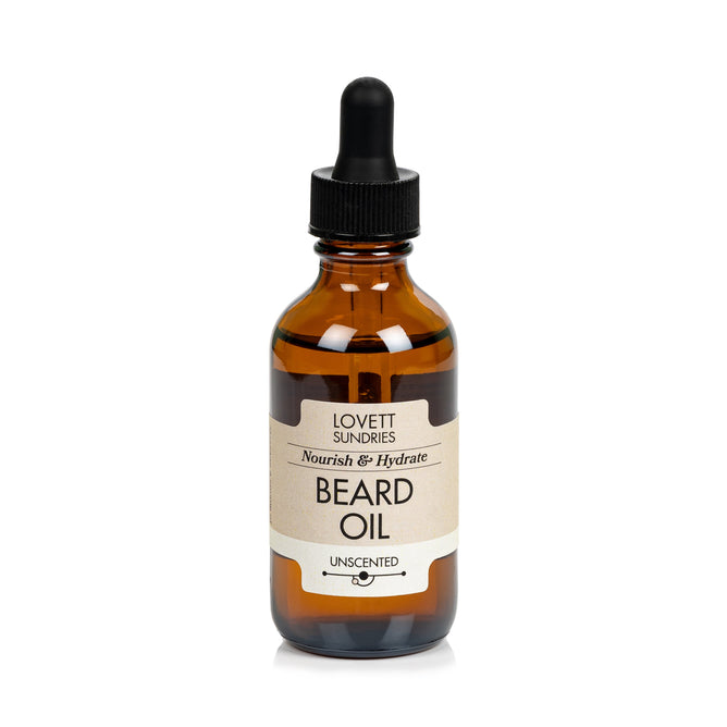 A brown glass dropper bottle labeled Lovett Sundries Beard Oil features Unscented. Crafted with organic oils, this facial hair care essential includes a black cap and dropper for easy application.