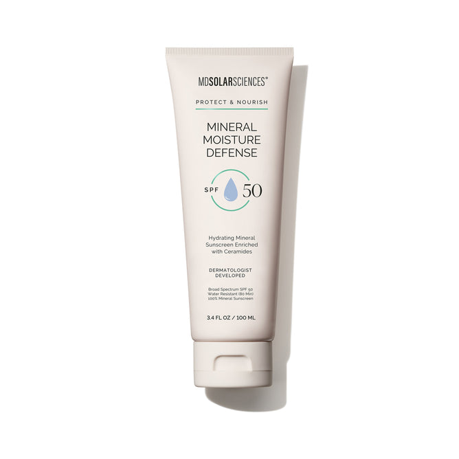 A white tube of MDSolarSciences Mineral Moisture Defense SPF 50 stands upright against a white background, displaying blue and green logo and text.