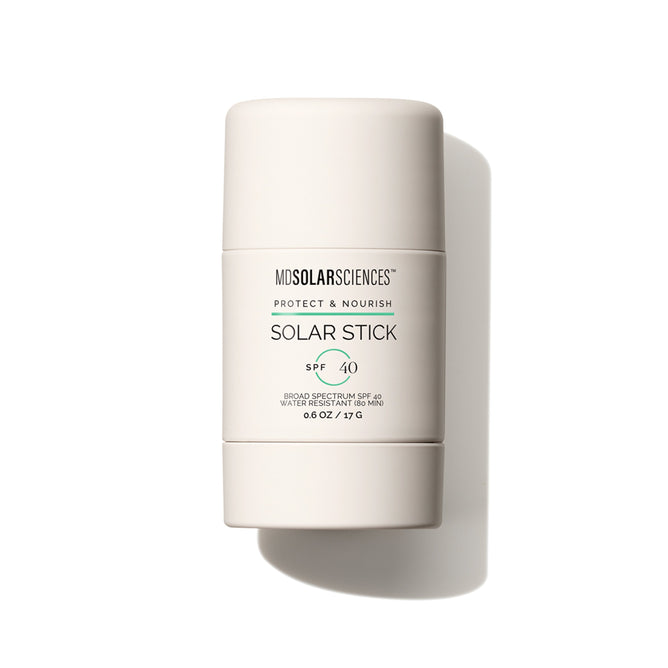 The MDSolarSciences Solar Stick SPF 40, a portable mineral sunscreen stick enriched with vitamins C & E, stands upright in its beige tube with the label clearly visible against a white background.
