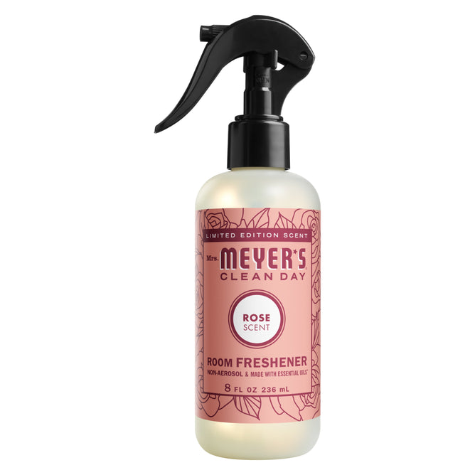 Mrs. Meyers Room Freshener in Rose features a pink floral label and black spray nozzle, is non-aerosol, and offers 8 fl oz of essential oil purity for a delightful aroma.