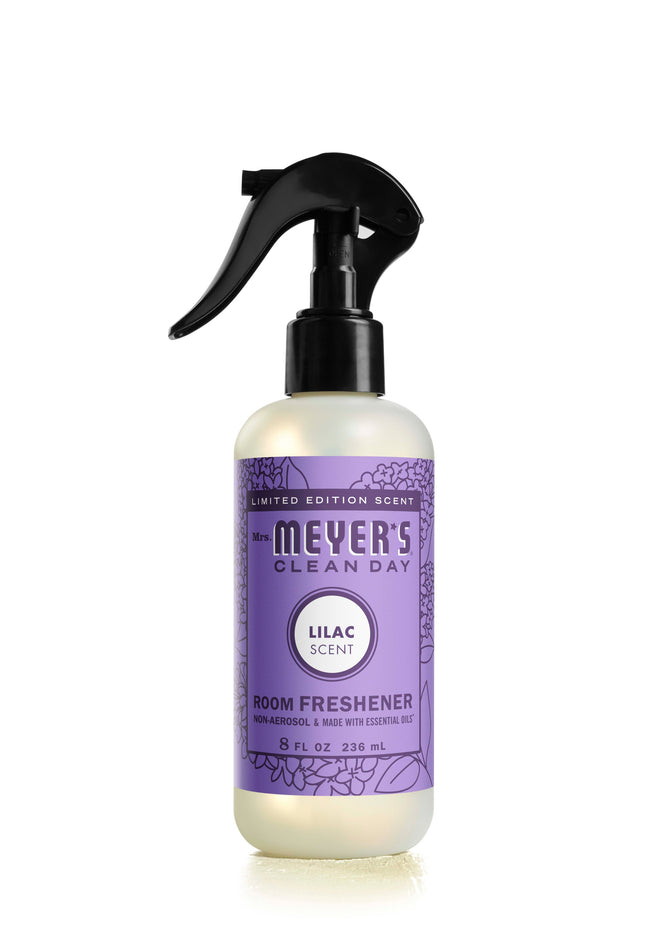 Mrs. Meyers Room Freshener in Lilac scent features essential oils and a purple label with floral designs, highlighting its limited edition. The 8 oz (236 ml) non-aerosol spray effortlessly refreshes any space.