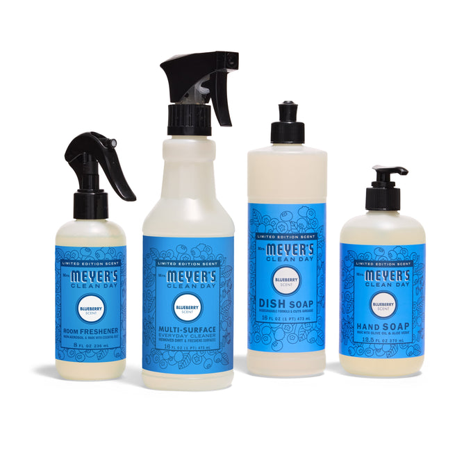 The Mrs. Meyer’s Endless Summer Cleaning Set in Blueberry features four blue-labeled products—Room Freshener, Dish Soap, Multi-Surface Cleaner, and Hand Soap—arranged side by side on a white background.