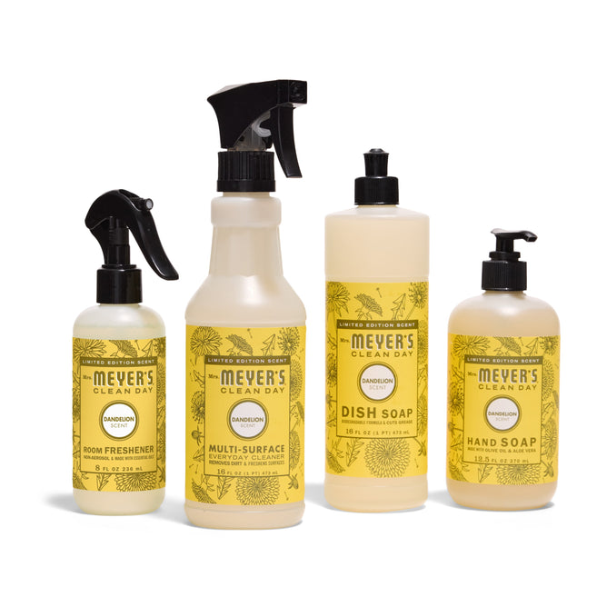 Four Mrs. Meyer’s Endless Summer Cleaning Set - Dandelion products—Multi-Surface Cleaner, Hand Soap, Room Freshener Spray, and Dish Soap—are arranged in a row on a white background.