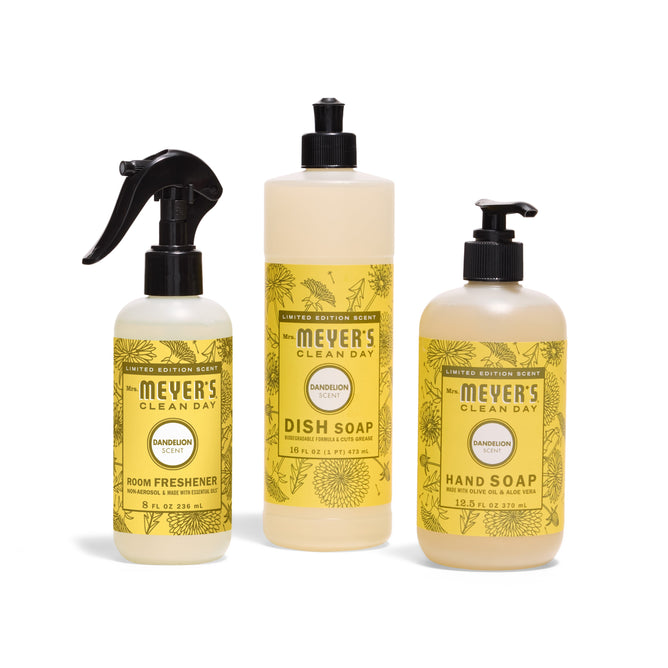 Three Mrs. Meyers Scents & Sun Essentials - Dandelion products—a Room Refresher spray, Dish Soap with a pump, and Hand Soap—are displayed on a white background.