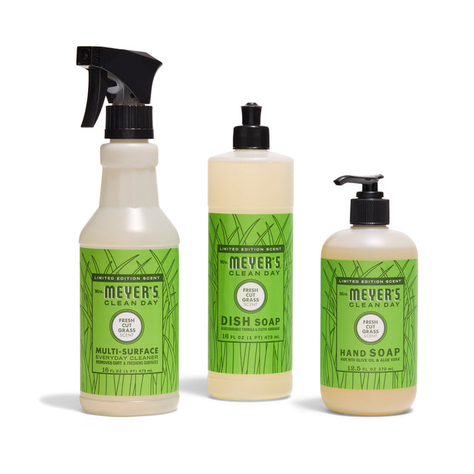 The Mrs. Meyers Sun & Suds Set - Fresh Cut Grass includes three green-labeled products: Multi-Surface Cleaner spray, Dish Soap bottle, and Hand Soap pump bottle.
