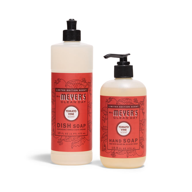 Two bottles of Mrs. Meyers Sunsational Sink Essentials- Tomato Vine: a limited edition set with Dish Soap (flip cap) and Hand Soap (pump), both with red labels.