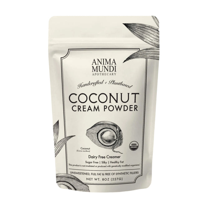 A white resealable pouch labeled Anima Mundi COCONUT CREAM, Dairy Free Creamer features botanical art and product details, highlighting its USDA organic, dairy-free, unsweetened, and made from nutrient-rich coconut meat—a true superfood.