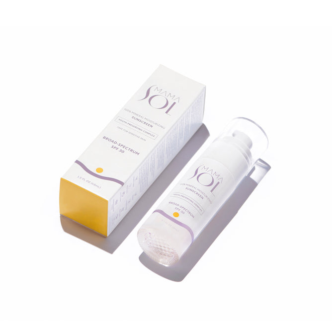 A white and yellow box labeled “Mama Sol 100% Mineral Moisturizing Sunscreen SPF 30” sits next to a matching pump bottle on a white background, both casting soft shadows. This mineral sunscreen provides gentle, reliable protection.