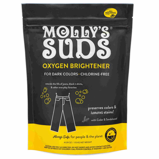 A black and yellow bag of Mollys Suds Oxygen Whitener, for dark colors and chlorine-free, features a jeans illustration and promotes its stain-lifting, natural bleach alternative formula—safe for people, the planet, and color.