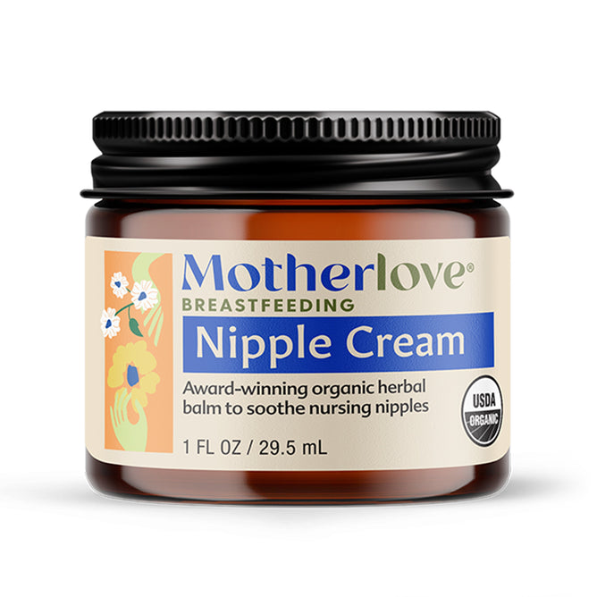 A small brown jar of Motherlove Nipple Cream with a black lid, featuring a floral design, made to soothe nursing nipples.