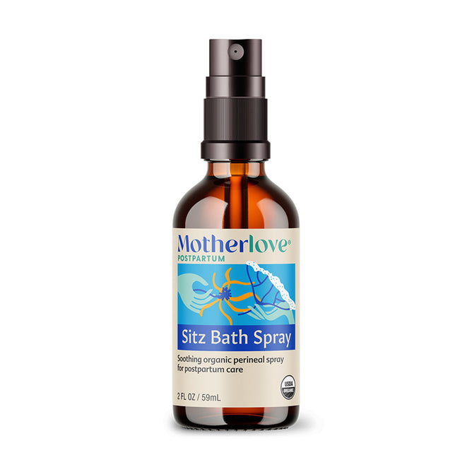 A brown bottle of Motherlove Green Salve with a black top, labeled as a soothing, cruelty-free organic balm. The label features blue and green colors with floral graphics, ideal for gentle care.