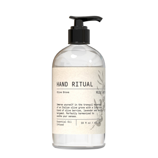 A clear pump bottle labeled Muse Apothecary Hand Soap - Olive Collection contains nourishing soap with olives, lavender, and vanilla. Minimalist black text on a cream label describes this essential oil hand wash.