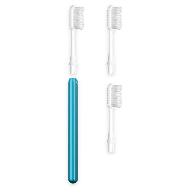 The Nada Medium Adult Toothbrush in blue stands upright beside three white interchangeable brush heads with transparent covers, arranged on a white background for easy, low-waste replacement.