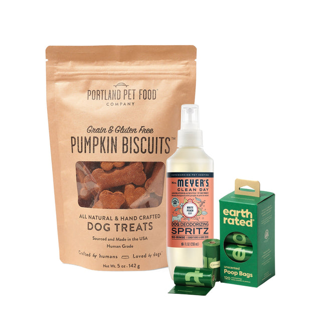 The Grove Collaborative New Dog Everyday Trio includes pumpkin biscuits, deodorizing spritz, and Earth Rated poop bags with two rolls displayed in front.