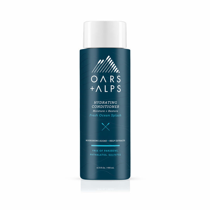A blue Oars + Alps Hydrating Conditioner bottle labeled “Fresh Ocean Splash.” This sulfate-free formula with algae and kelp extracts delivers intense moisture without parabens or phthalates.