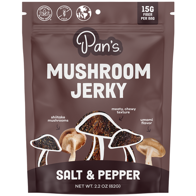 Pans Salt & Pepper Mushroom Jerky, a vegan, gluten-free snack, contains 15g of fiber per bag and features a meaty, chewy texture with rich umami flavor. The packaging is decorated with shiitake mushroom illustrations.