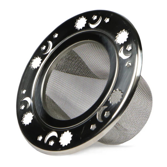 The Plum Deluxe Celestial Mesh Tea Infuser is a round stainless steel strainer with a fine mesh base and decorative star, sun, and crescent moon cutouts on the outer rim.