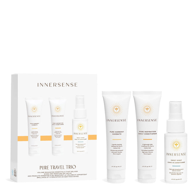 The Innersense Organic Beauty Pure Travel Trio features a white box and three white bottles: Pure Harmony Hairbath, a sulfate-free shampoo; Pure Inspiration Daily Conditioner; and Sweet Spirit Leave In Conditioner for clean, weightless moisture.