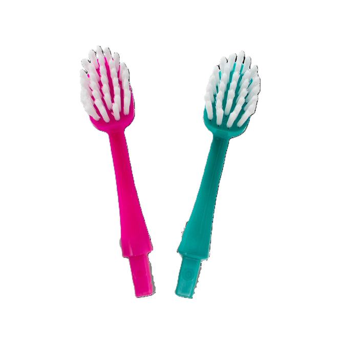 The Radius Big Kidz® Forever Brush™ 2 Pack Replacement Heads, featuring pink and teal options with white bio-based bristles, are displayed side by side on a white background for a deeper clean.