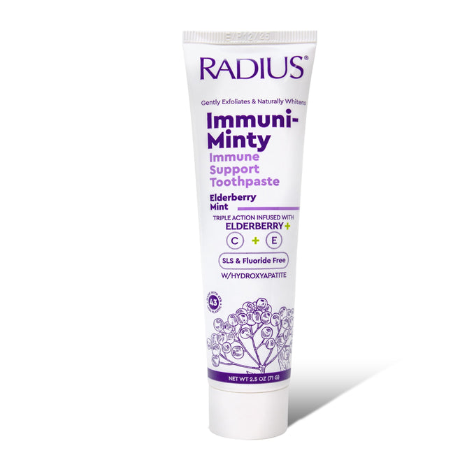 A white tube of Radius Immuni-Minty Adult Toothpaste in Elderberry Mint flavor, with purple graphics, featuring hydroxyapatite for enamel strength, immune support, elderberry extract, and a fluoride-free formula.
