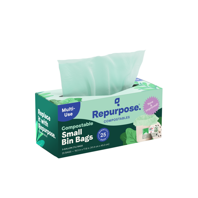 A box of Repurpose Compostable Small Bin Bags in green and white, labeled “Multi-Use” with 25 bags; one light green bag is partially pulled out.