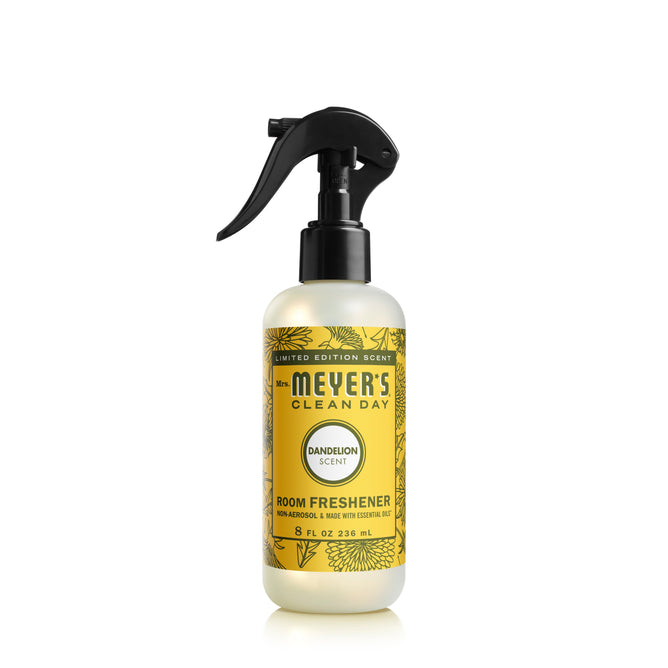 The yellow Mrs. Meyers Room Freshener, an 8 fl oz (236 mL) non-aerosol spray with a black nozzle and floral label, offers a garden-inspired dandelion scent to revitalize any space. This limited edition product captivates with its delightful aroma.