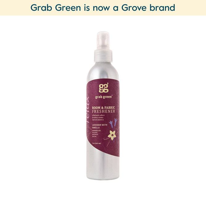A silver spray bottle of grab green Room and Fabric Freshener - Lavender with Vanilla (Coming Soon!) is shown against a white background. Infused with essential oils to neutralize odors. Text reads, grab green is now a Grove brand.