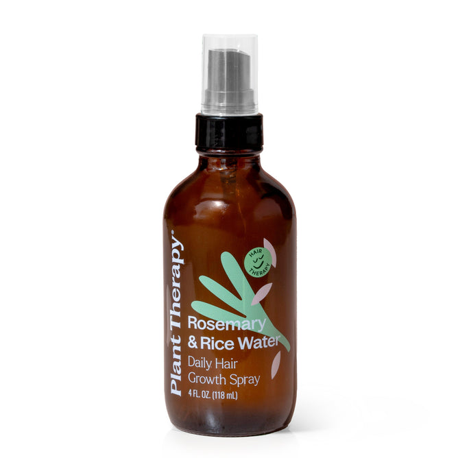 A 4 fl oz brown bottle of Plant Therapys Rosemary & Rice Water Spray features a spray nozzle cap with a label showcasing a green graphic of leaves and rice grains, ideal for repairing damage and promoting luscious hair growth.