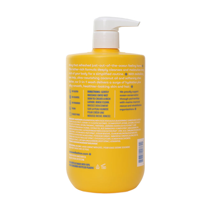A yellow pump bottle of The Seaweed Bath Co Value Size 3 in 1 Wash with a simple design features a white pump, blue lettering, and bilingual English/French text on the back listing directions, ingredients like shea butter, and product details.