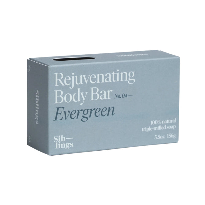 A 5.5 oz (156g) blue-gray box of Refreshing Body Bar by Siblings, crafted with 100% natural triple-milled soap and enriched with French green clay and essential oils, features a minimalist design with sleek white text.
