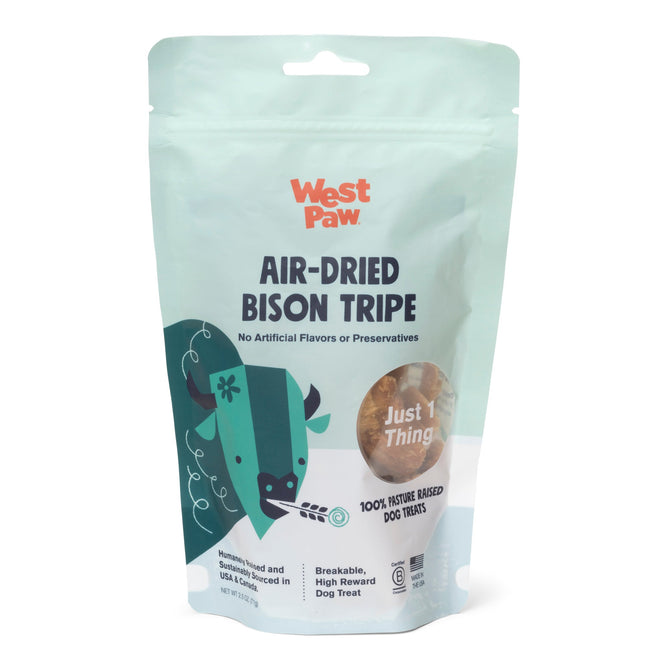 A teal and white West Paw bag labeled Dog Treat – Air-Dried Bison Tripe, Natural Source of Protein & Omegas stands upright, featuring a bison illustration and text noting its made from 100% bison with no artificial flavors or preservatives.