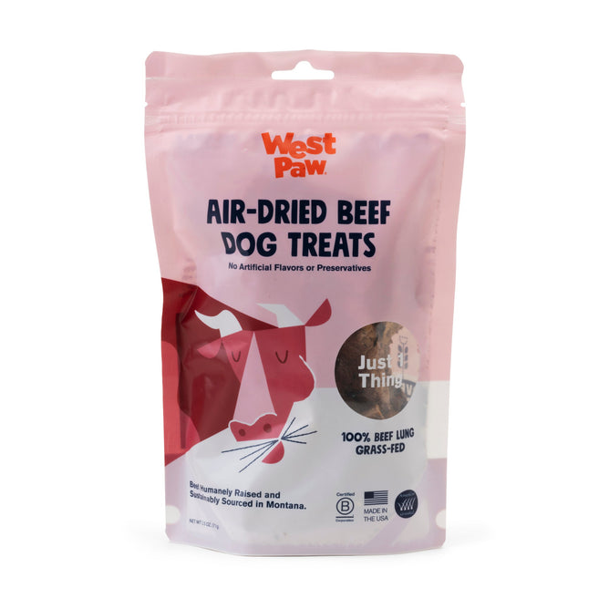 A pink resealable bag of West Paws Dog Treat – Air-Dried Beef Lung, High Protein for Muscle & Energy, featuring a cartoon cow. Made with 100% grass-fed beef lung and no artificial flavors or preservatives.