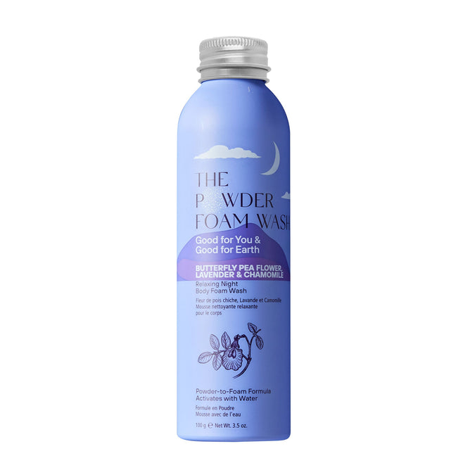 The Powder Shampoos Relaxing Night Body Foam Wash features a crescent moon design on its blue bottle. It contains butterfly pea flower extract, lavender essential oils, and chamomile, boasting a powder-to-foam formula with eco-friendly benefits.
