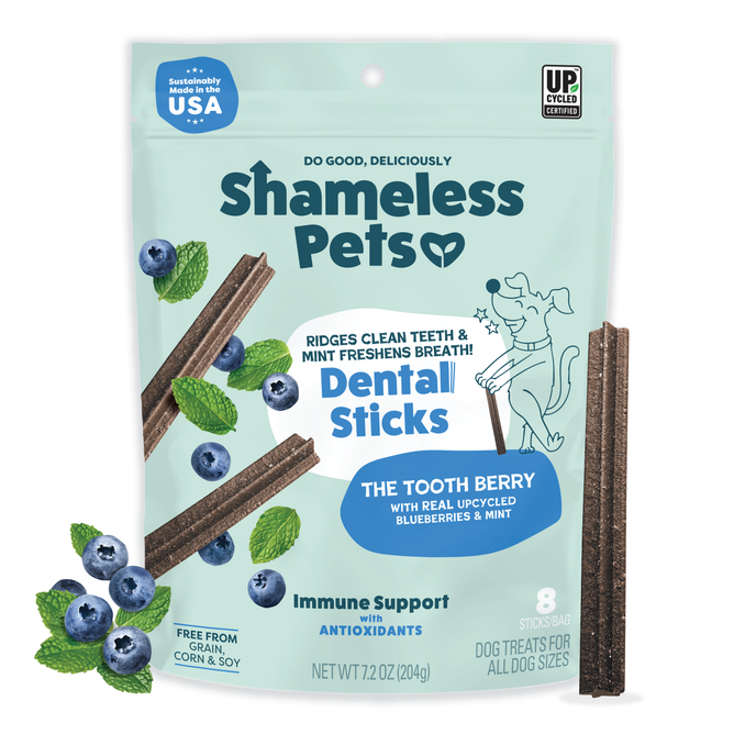 A bag of Shameless Pets The Tooth Berry Dental Stick for dogs, with blueberry and mint images, promotes grain-free treats featuring immune support, antioxidants, and upcycled ingredients on its packaging.