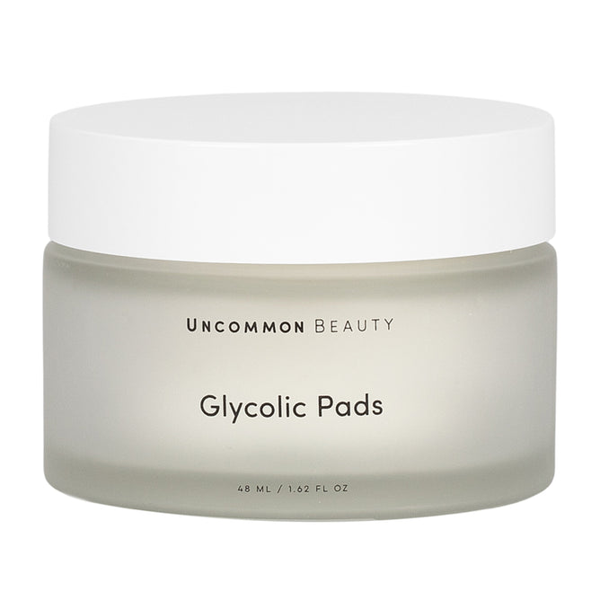 Uncommon Beauty Glycolic Pads come in a frosted jar with a white lid, containing 48 ml (1.62 fl oz) of exfoliating pads to help minimize pores and refresh your skin.