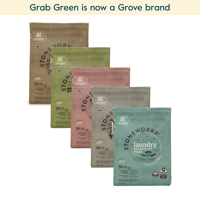 Five grab green Stoneworks Laundry Pods - Variety Pack (Coming Soon!) bags in different colors are displayed. Above them, text reads: grab green is now a Grove brand. Scents include Oak Tree and Rose Petal for variety.