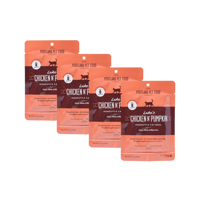 Four orange pouches of Portland Pet Food Companys Lukes Chicken N Pumpkin Homestyle Wet Puree Cat Food Meal, grain-free and human-grade, are arranged in a row with a cat silhouette and product details on the packaging.