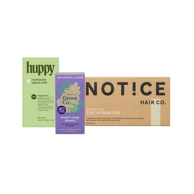 Grove Collaboratives Traveller Essentials - Small Bundle includes three eco-friendly personal care products: Huppy Toothpaste Tablets Refill (green pack), Grove Co. Hand Soap Sheets (purple box), and Notice Hair Co. shampoo & conditioner bars (brown box).