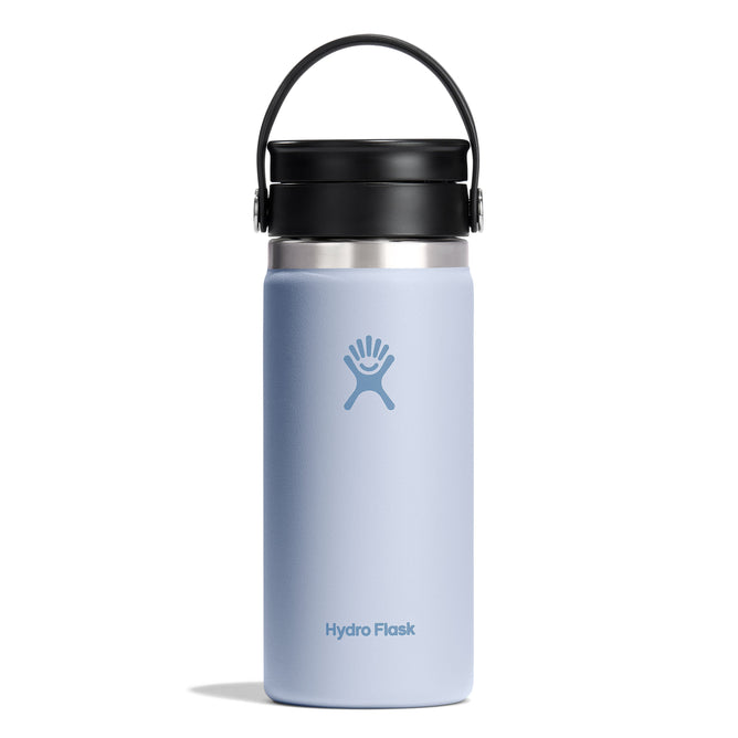 The 16 oz Hydro Flask Wide Mouth Bottle with Flex Sip Lid™, in light blue with a black strap, features an abstract figure logo in the center. Its TempShield double-wall vacuum insulation keeps drinks hot, and it stands upright against a plain white background.