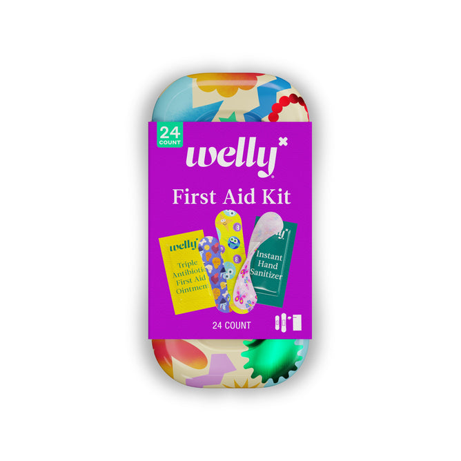 The Welly On-The-Go First Aid Kit features a vibrant tin with a purple First Aid Kit label and images of included items: flexible fabric bandages, antibiotic ointment, and instant hand sanitizer. Contains 24 travel-ready essentials.